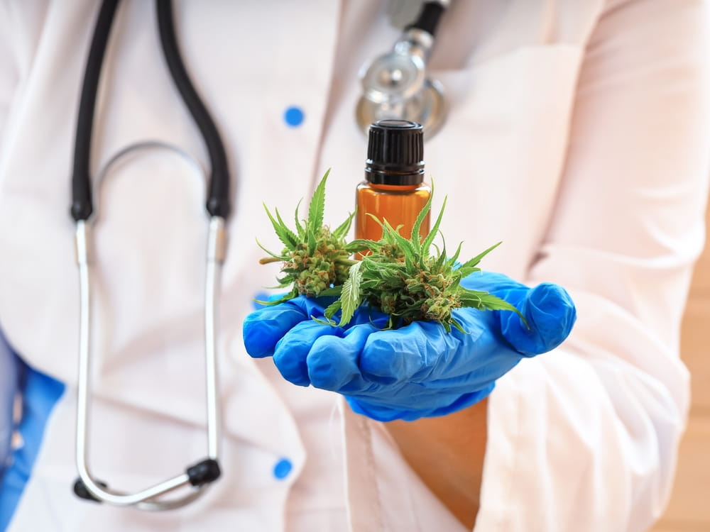 Doctor holding medical marijuana and cannabis oil for a certified Pennsylvania patient